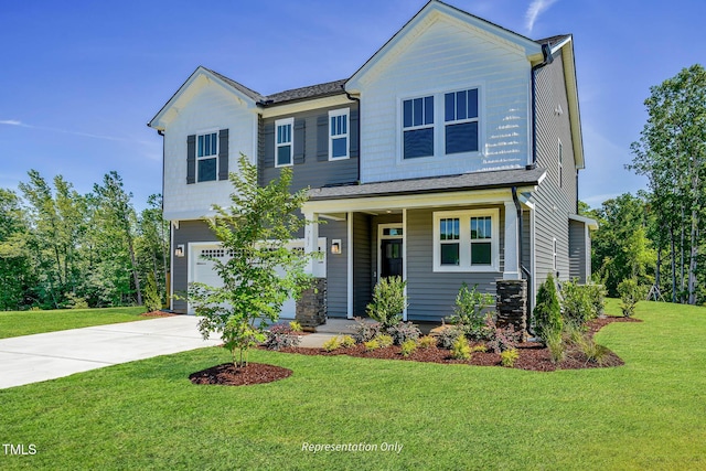 view of front of property featuring a garage and a front lawn