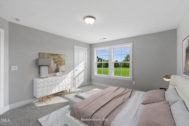 bedroom featuring light colored carpet