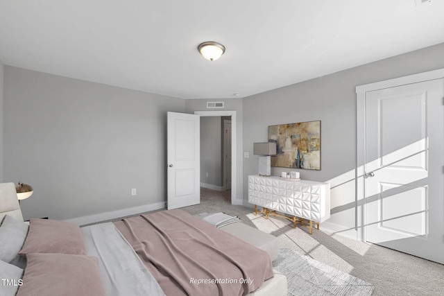 bedroom featuring light colored carpet