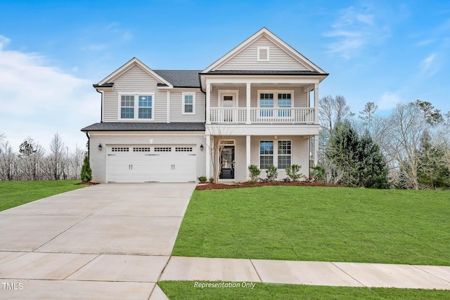 view of front of home featuring a garage, a balcony, and a front yard