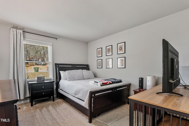 bedroom featuring light carpet