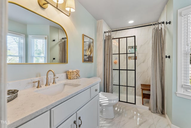 bathroom with vanity, curtained shower, and toilet