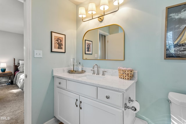 bathroom with vanity and toilet