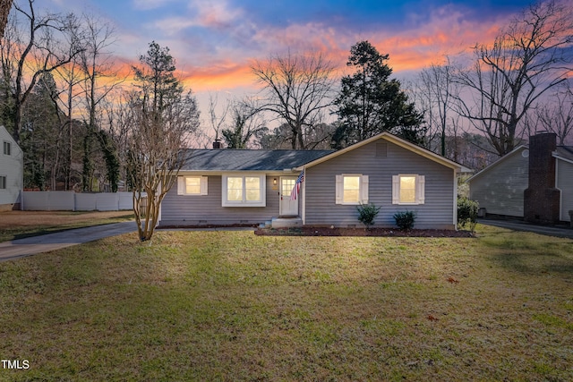 ranch-style house with a yard