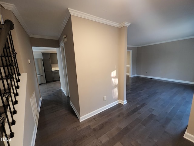 hallway with dark hardwood / wood-style floors and ornamental molding