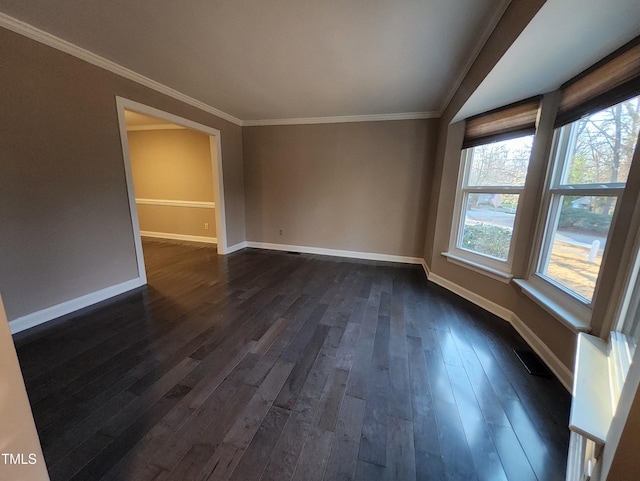 unfurnished room featuring crown molding and dark wood-type flooring