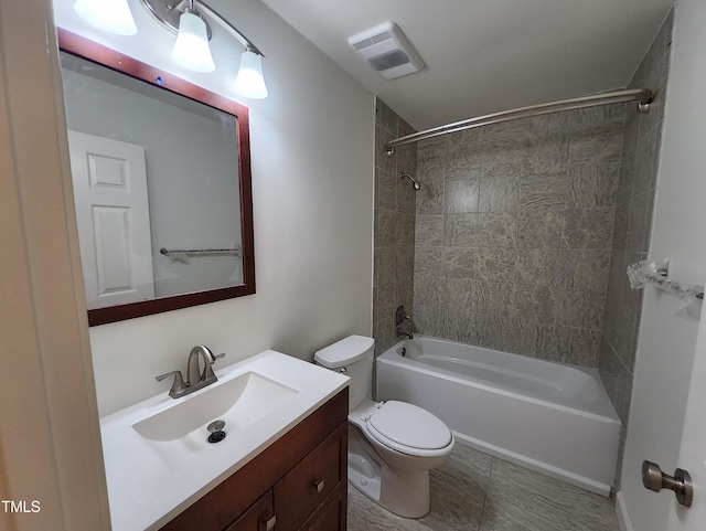 full bathroom featuring vanity, toilet, and tiled shower / bath combo