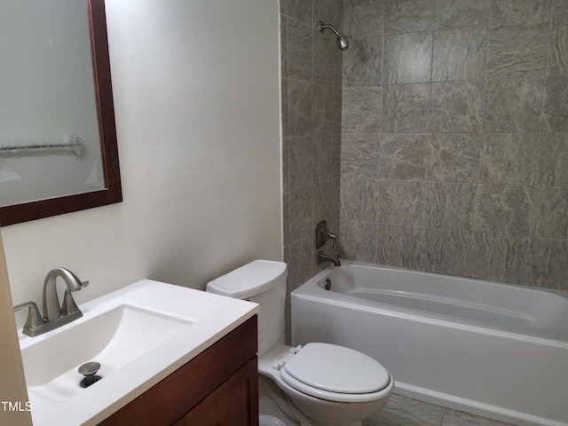 full bathroom with vanity, toilet, and tiled shower / bath combo