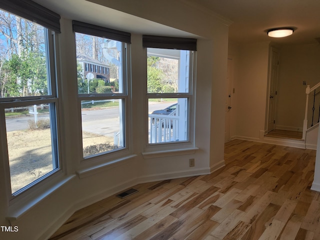 spare room with light wood-type flooring