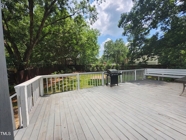 4300 Hickory Ridge Dr, Raleigh, NC 27609 - wooden deck with area for grilling and a fenced backyard