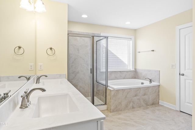 bathroom with tile patterned flooring, vanity, and shower with separate bathtub