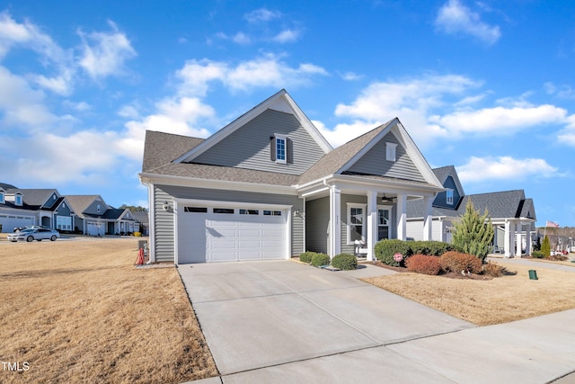 view of front of house featuring a front yard and a garage