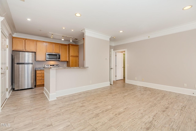 kitchen featuring kitchen peninsula, light stone counters, ornamental molding, and stainless steel appliances