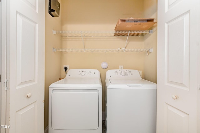 washroom with washing machine and dryer