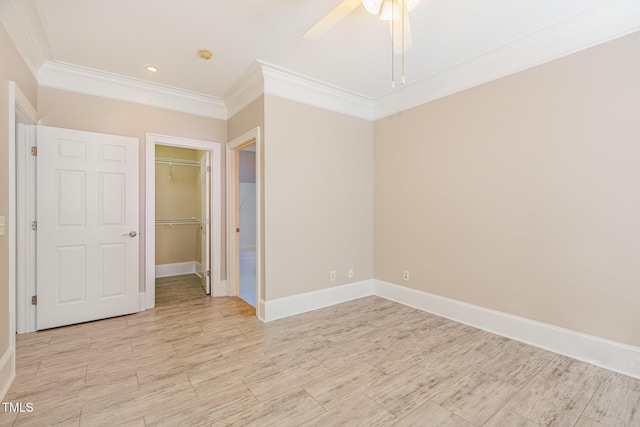 unfurnished bedroom featuring ceiling fan and crown molding