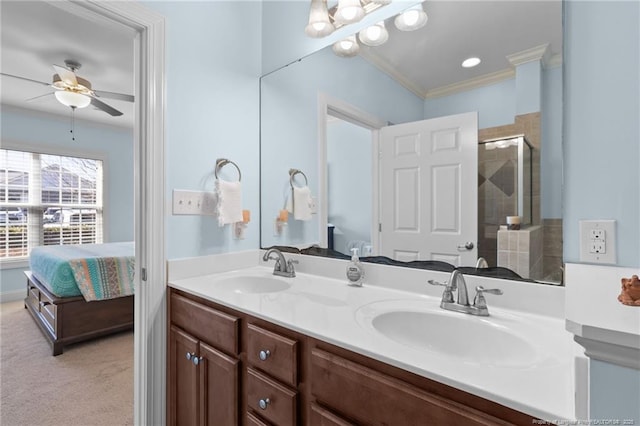 bathroom featuring ceiling fan, crown molding, vanity, and walk in shower