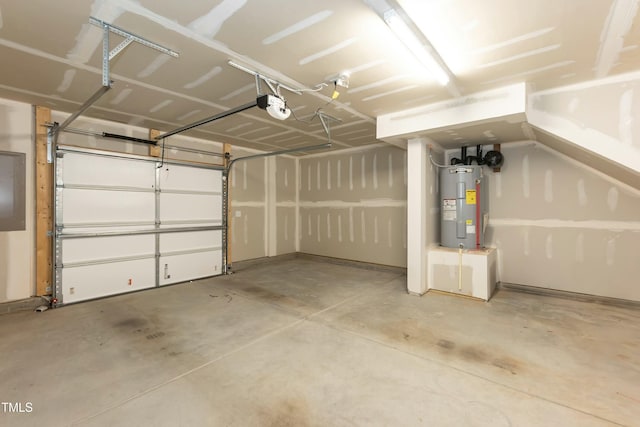 garage featuring electric water heater and a garage door opener