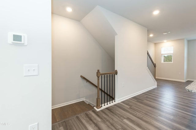 staircase featuring wood-type flooring