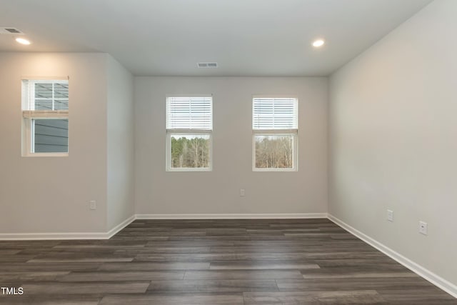 empty room with dark wood-type flooring