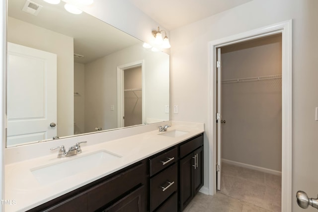 bathroom featuring tile patterned floors and vanity