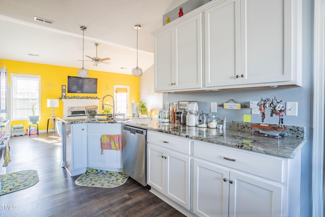 kitchen featuring sink, stainless steel dishwasher, pendant lighting, a healthy amount of sunlight, and white cabinets