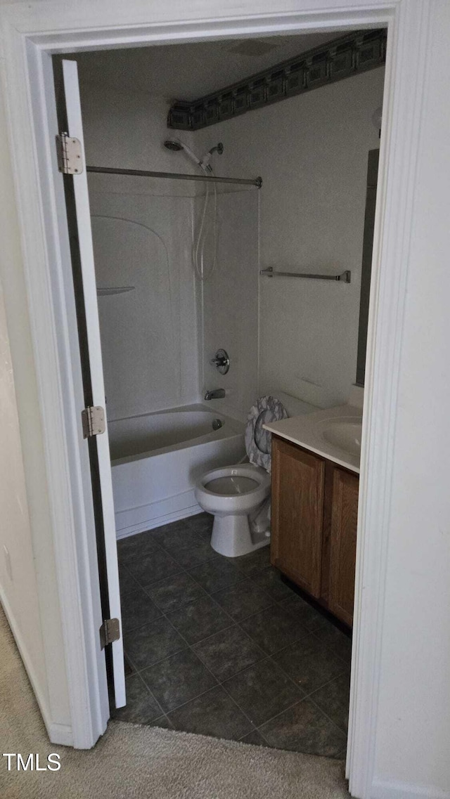 full bathroom featuring shower / bathing tub combination, tile patterned floors, vanity, and toilet