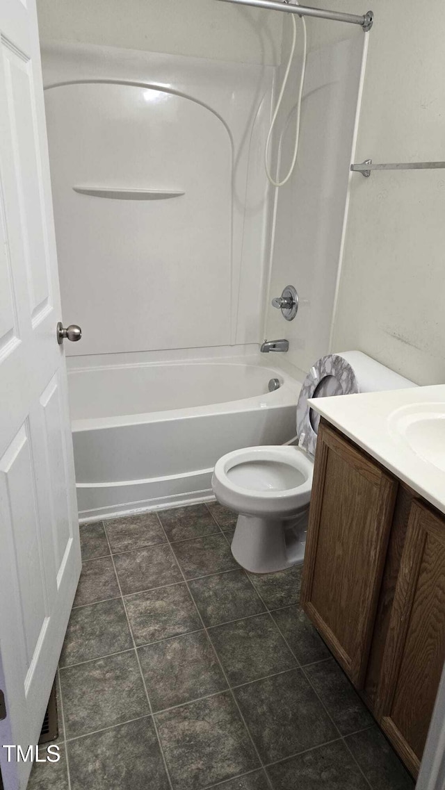 full bathroom with toilet, vanity, and tub / shower combination