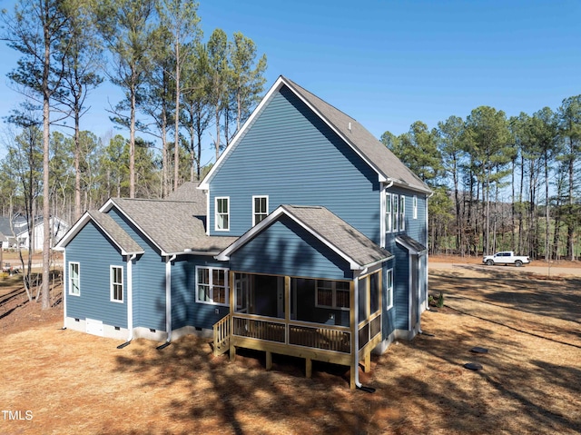 back of property featuring crawl space and a shingled roof