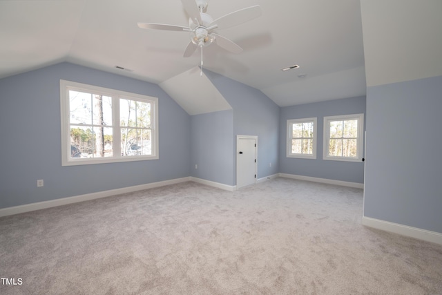 bonus room featuring visible vents, carpet floors, baseboards, and vaulted ceiling