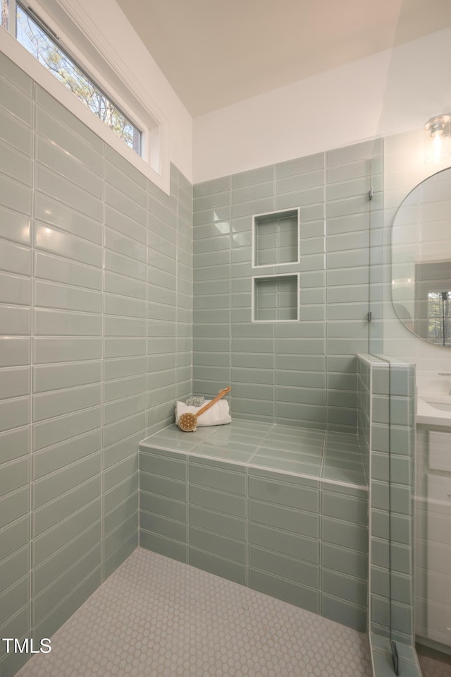 bathroom with tiled shower