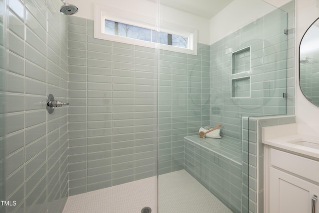 bathroom featuring a stall shower and vanity