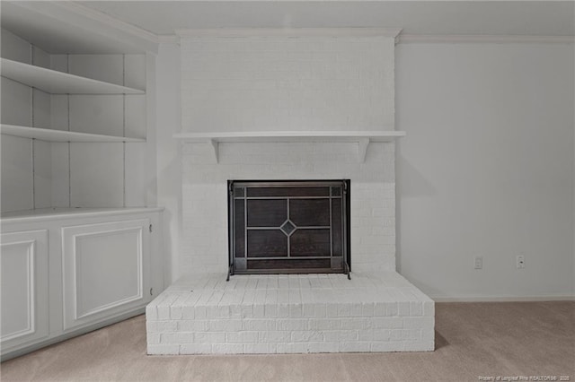 interior details featuring carpet flooring, ornamental molding, and a brick fireplace