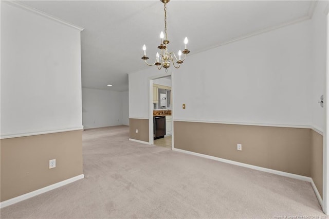 unfurnished room with light colored carpet, ornamental molding, and an inviting chandelier