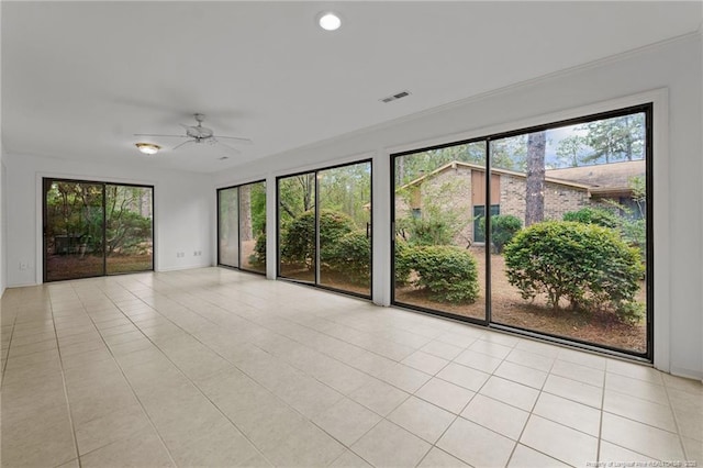 unfurnished room featuring ceiling fan and light tile patterned floors