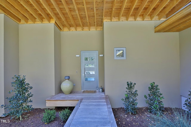 doorway to property with stucco siding