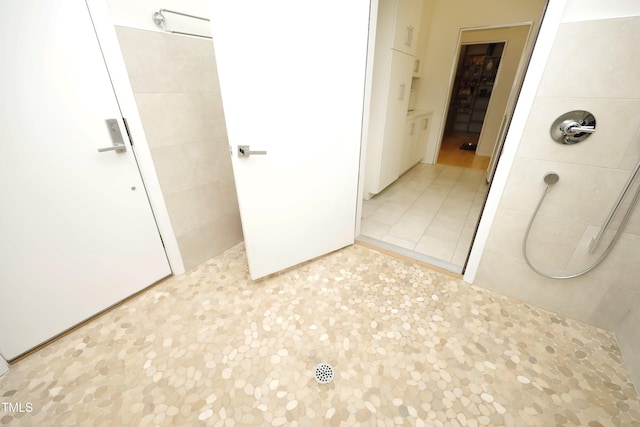 full bathroom with a tile shower