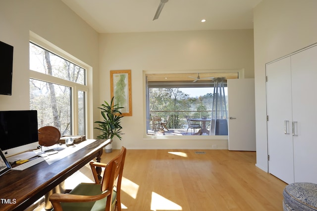 office with a ceiling fan, light wood-type flooring, and a wealth of natural light