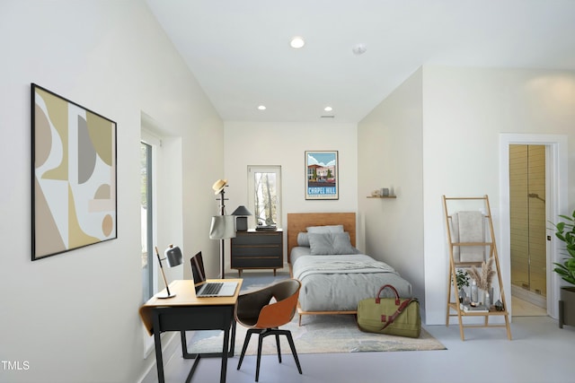 bedroom with recessed lighting and concrete floors