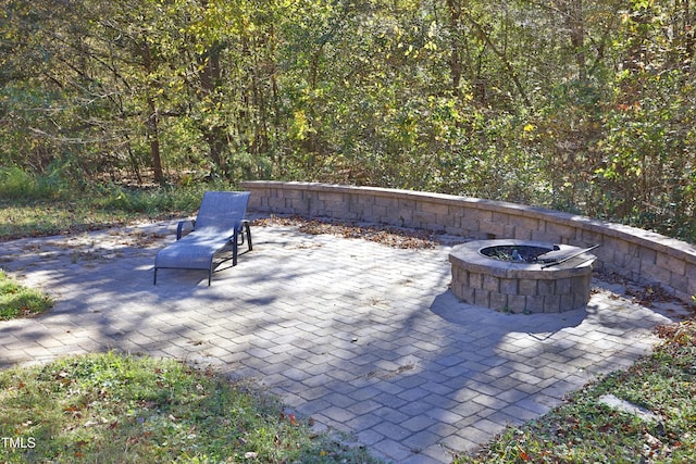 view of patio with a fire pit