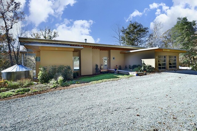 back of property with stucco siding