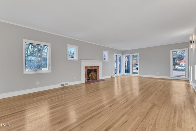 unfurnished living room with light hardwood / wood-style flooring and a fireplace