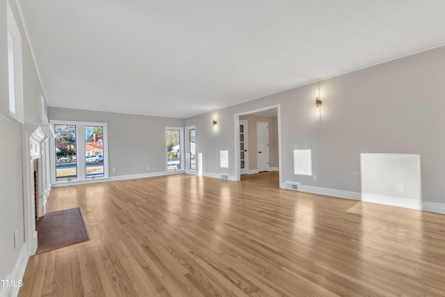 unfurnished living room with light hardwood / wood-style floors