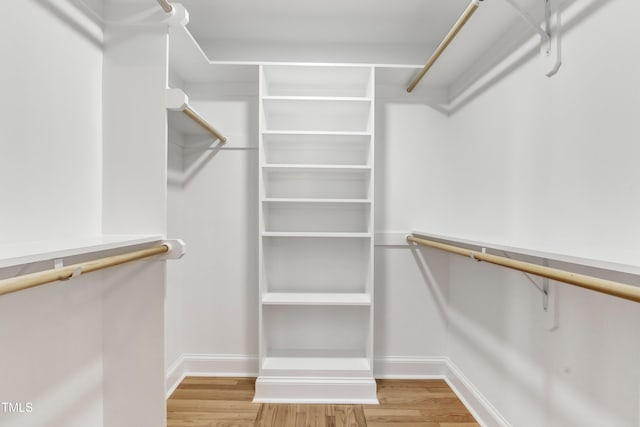 walk in closet featuring hardwood / wood-style flooring