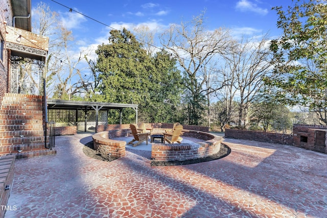 view of patio with an outdoor fire pit