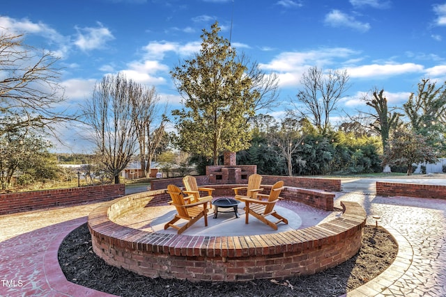 view of patio with a fire pit