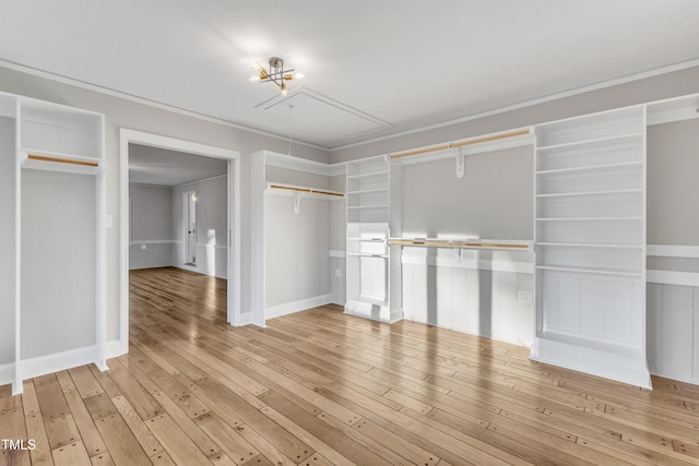 walk in closet featuring light hardwood / wood-style flooring