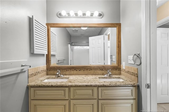 bathroom with a shower and vanity