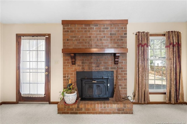 room details featuring carpet and a wood stove