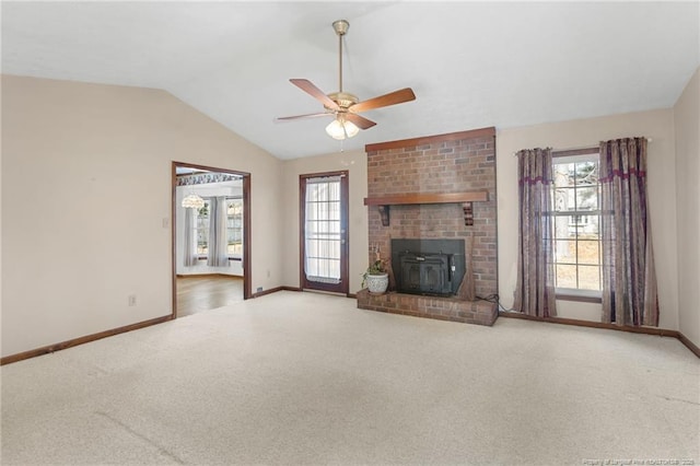 unfurnished living room featuring carpet flooring, ceiling fan, plenty of natural light, and lofted ceiling