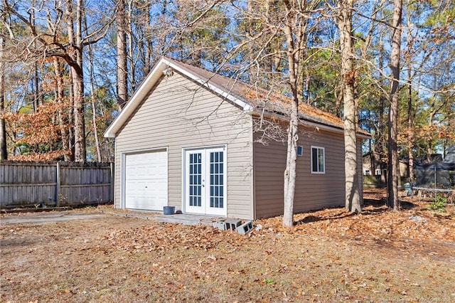 garage featuring french doors and a trampoline